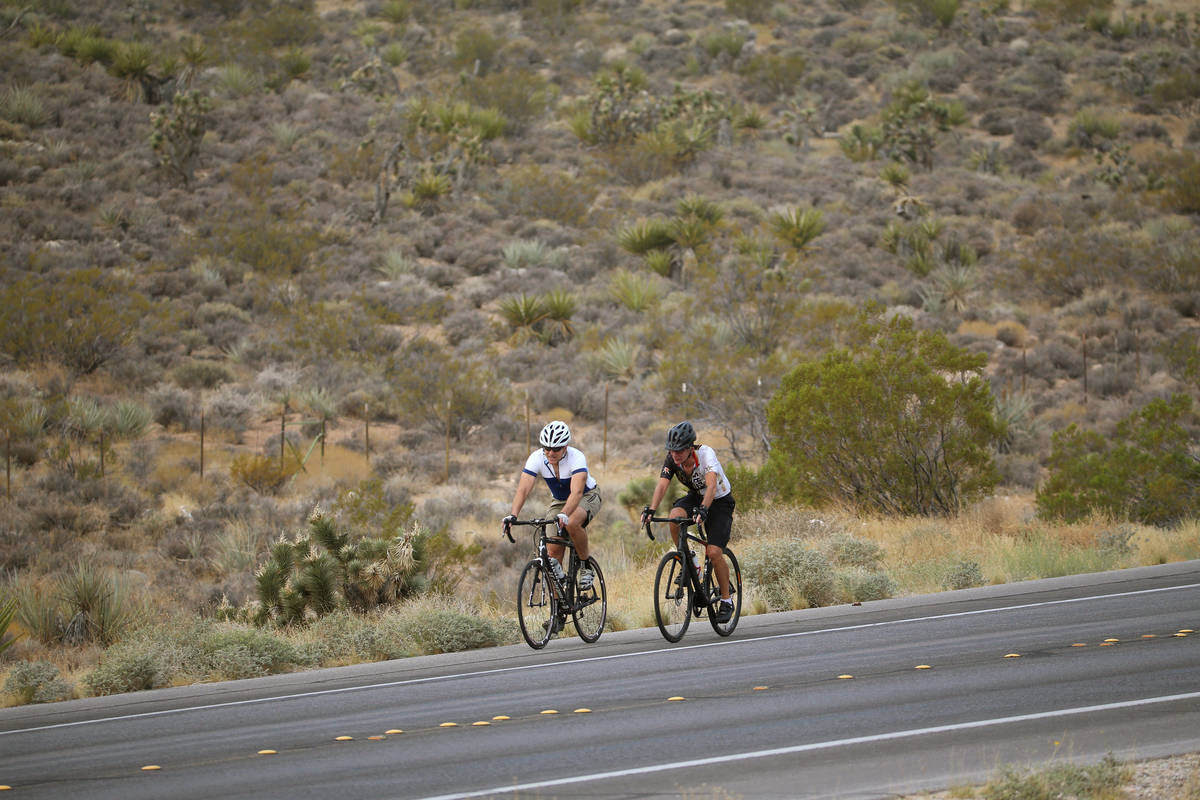 Cyclists ride on Red Rock Canyon Road in Las Vegas, Friday, Sept. 18, 2020. (Erik Verduzco / La ...