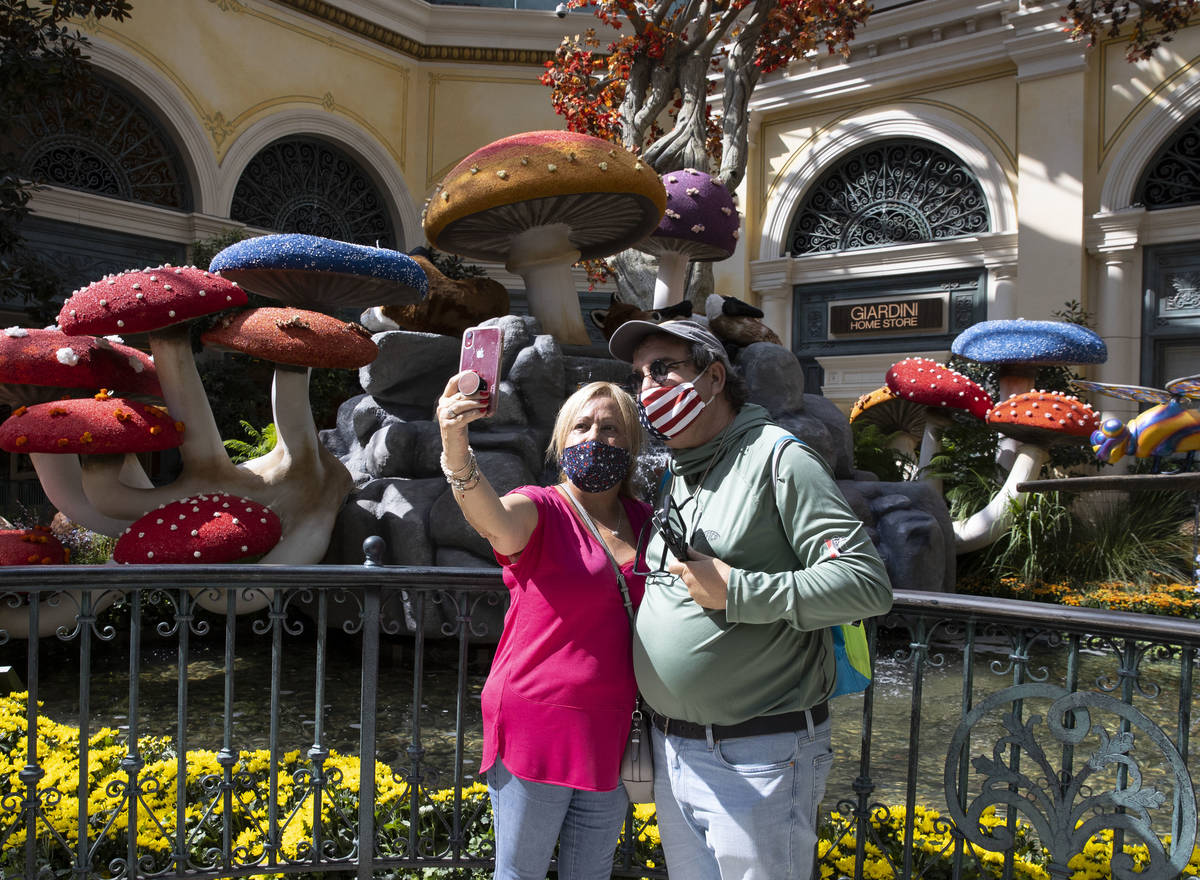 Marisel Vazquez, left, takes a selfie with Camilo Lopez, both visiting from Cuba, as they visit ...