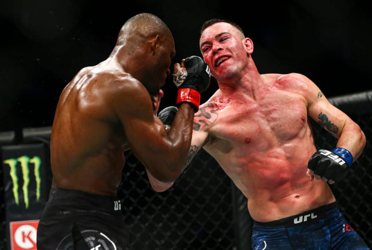 Kamaru Usman, left, fights Colby Covington during their welterweight title boutÊin UFC 245 ...