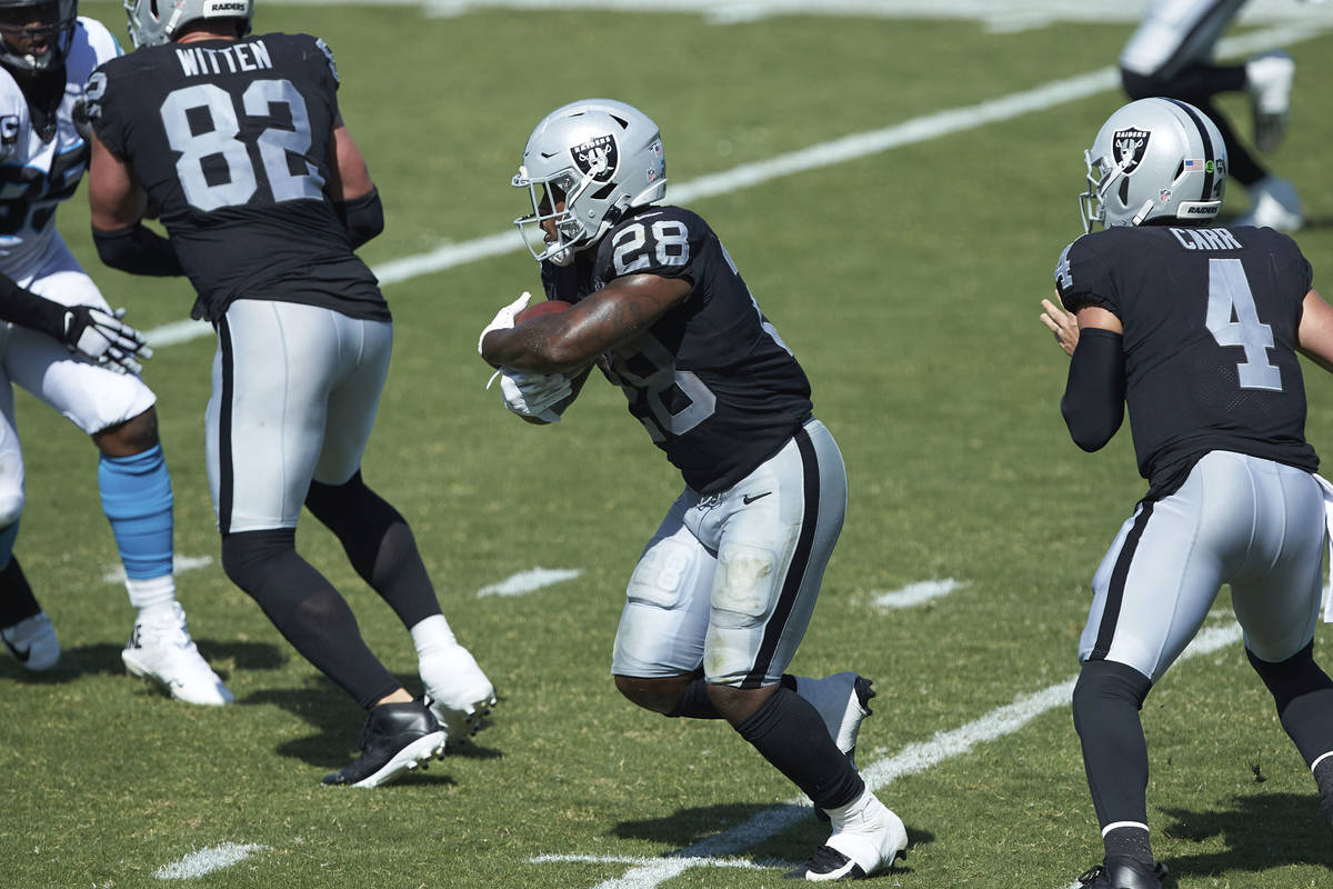 Las Vegas Raiders running back Josh Jacobs (28) runs with the ball during the second half an NF ...