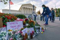 People gather at the Supreme Court on the morning after the death of Justice Ruth Bader Ginsbur ...