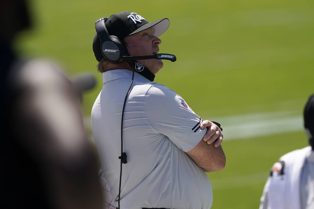 Las Vegas Raiders head coach Jon Gruden watches during the first half of an NFL football game a ...