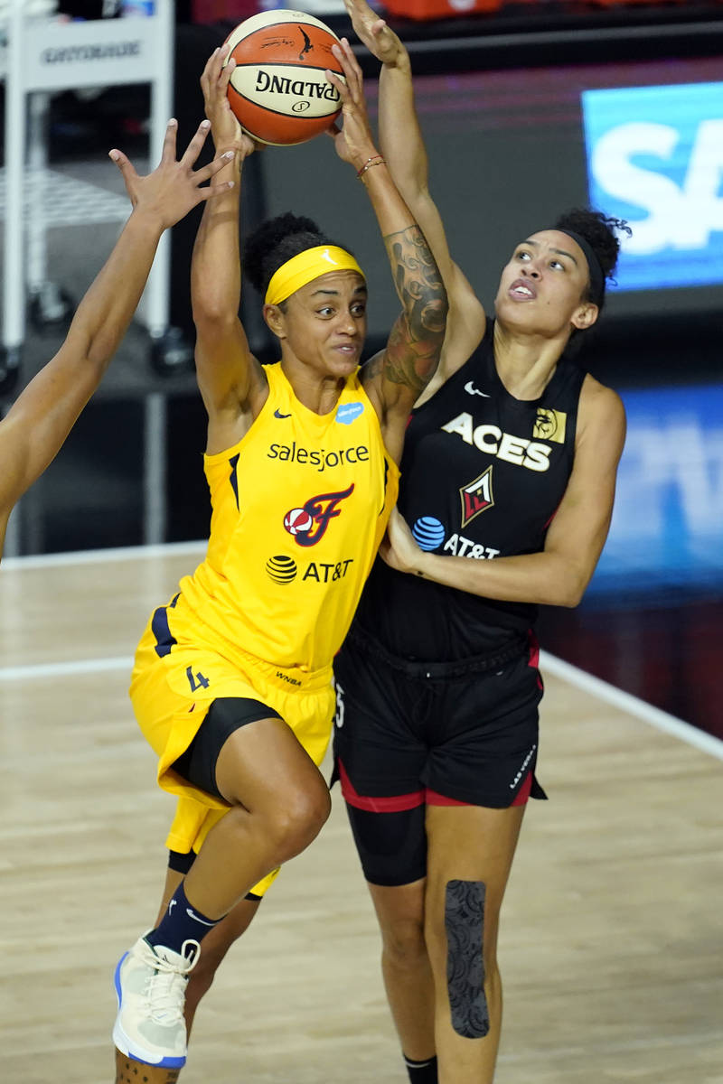 Indiana Fever forward Candice Dupree (4) goes up against Las Vegas Aces forward Dearica Hamby ( ...