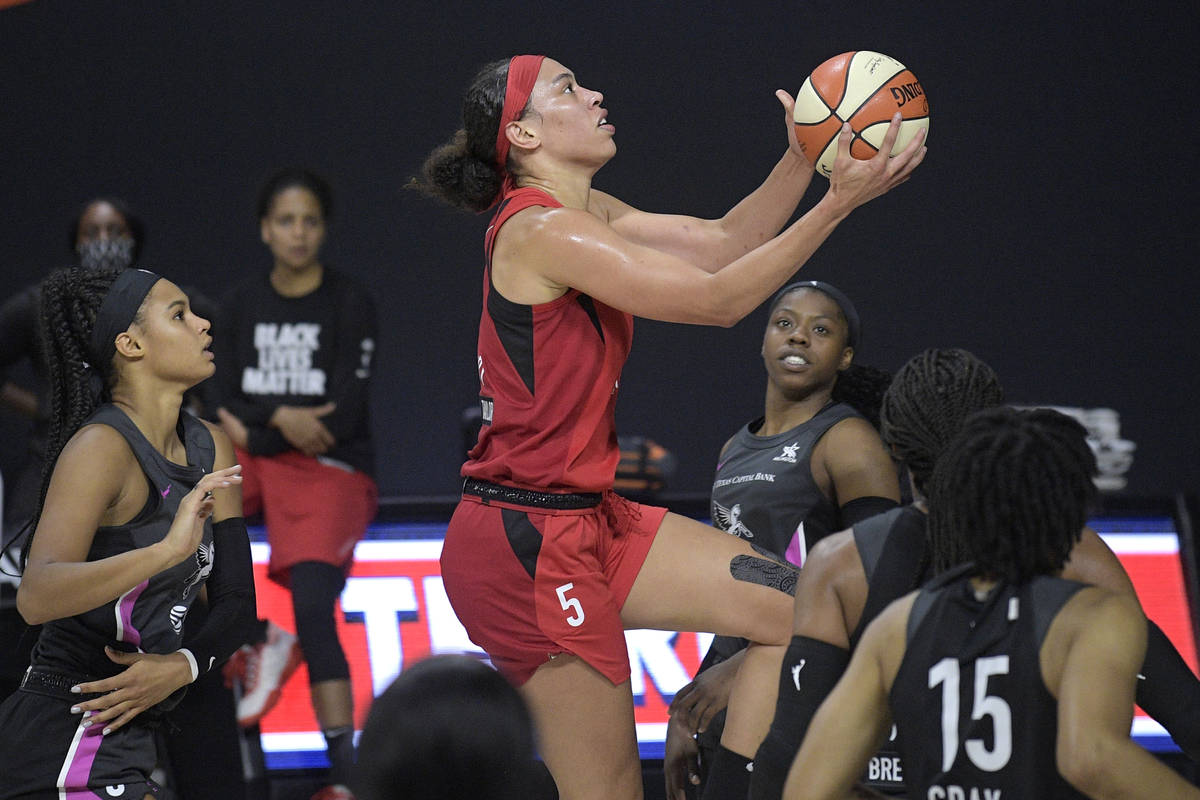 Las Vegas Aces forward Dearica Hamby goes up for a shot during the first half of the team's WNB ...