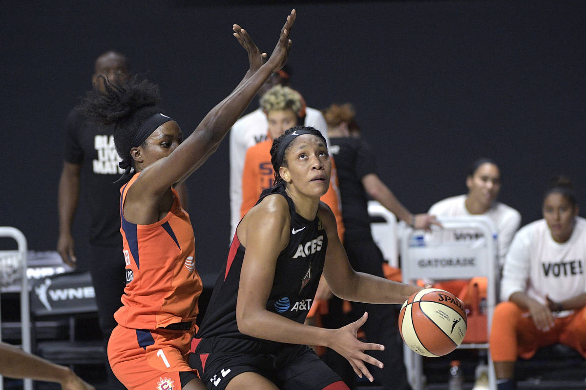 Las Vegas Aces center A'ja Wilson (22) sets up for a shot under the basket in front of Connecti ...