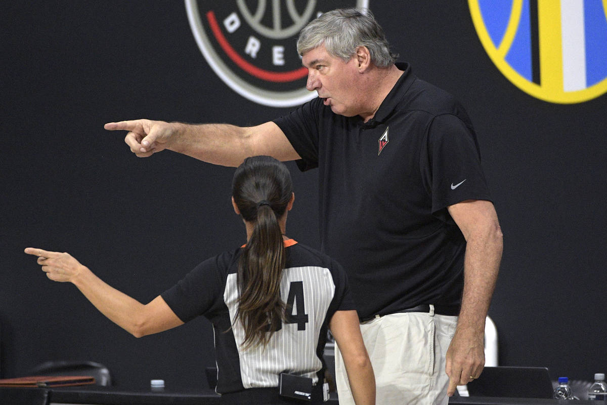 Las Vegas Aces head coach Bill Laimbeer, right, argues a call with official Maj Forsberg (34) d ...