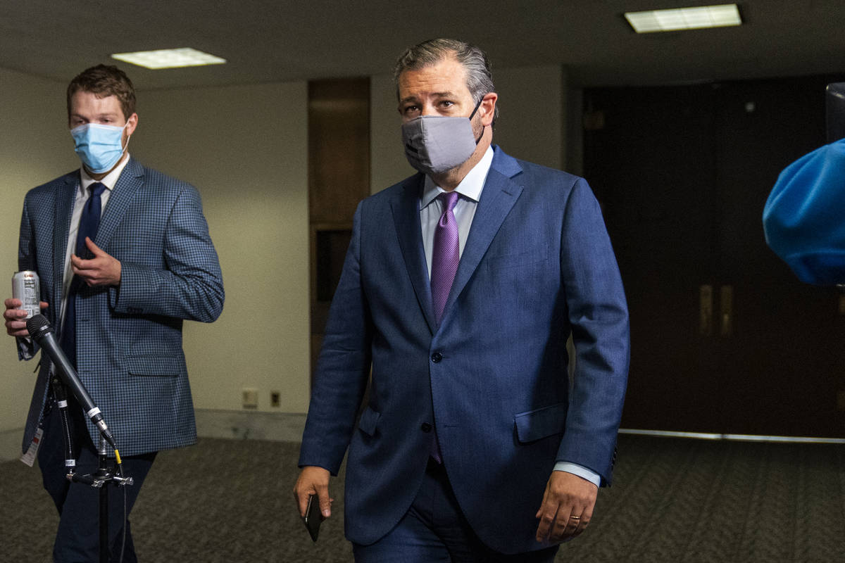 Sen. Ted Cruz, R-Texas, right, leaves a Senate Republican policy meeting on Capitol Hill, Thurs ...