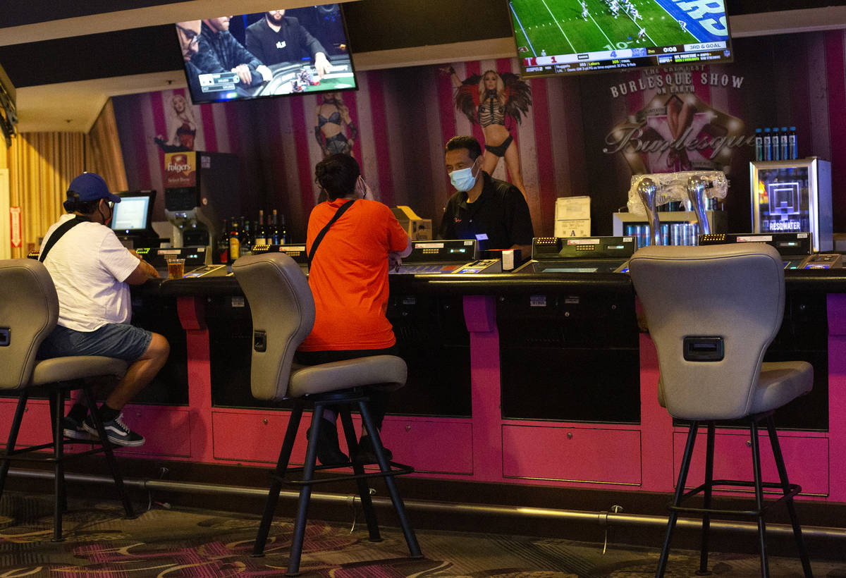 Chairs at a bar in Flamingo Las Vegas are spaced out to maintain social distance on Monday, Sep ...