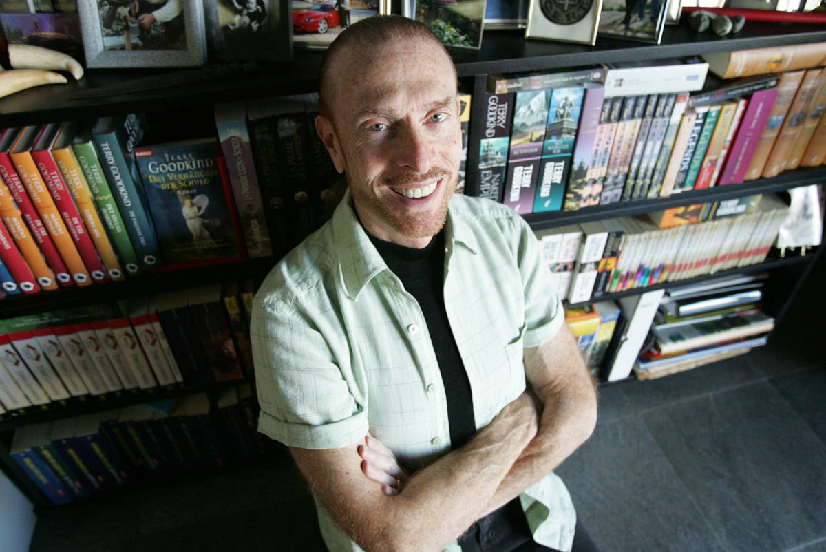 Terry Goodkind is shown next to numerous editions and translations of his novels on Friday, Feb ...