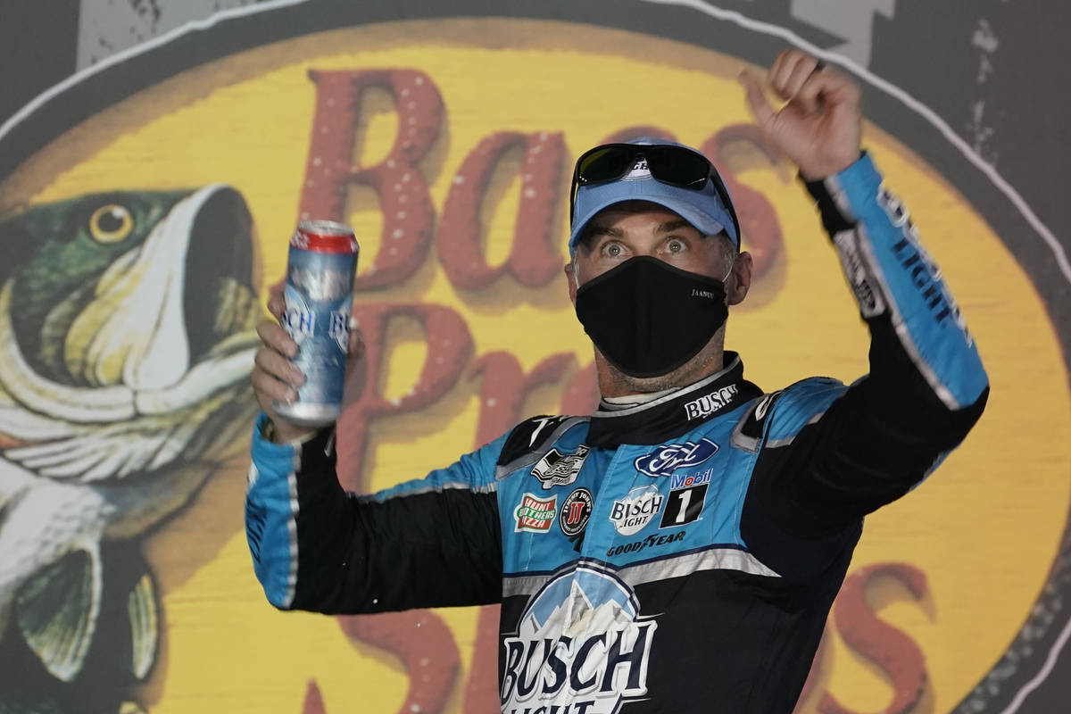 Kevin Harvick celebrates in Victory Lane after his win in the NASCAR Cup Series auto race Satur ...
