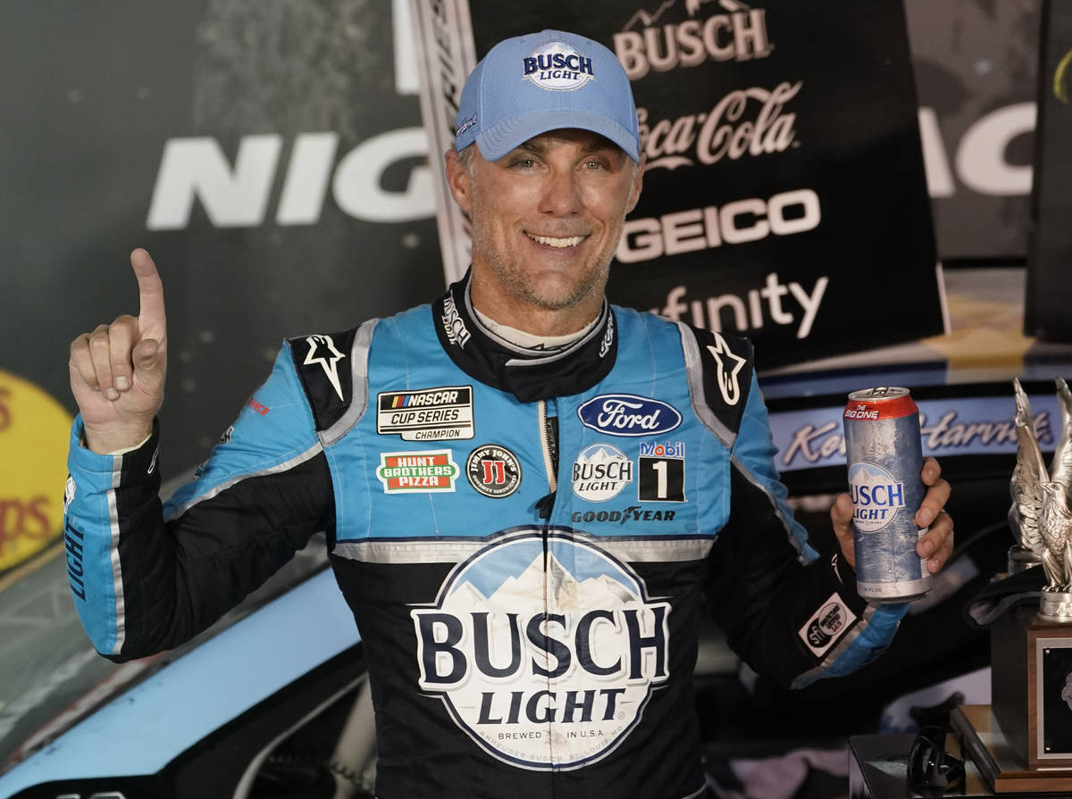 Kevin Harvick celebrates in Victory Lane after winning the NASCAR Cup Series auto race Saturday ...