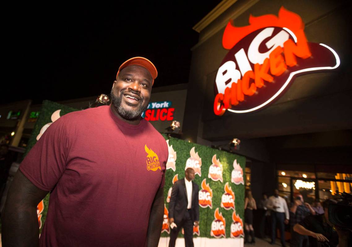 Retired NBA player Shaquille O'Neal smiles during the grand opening celebration of Big Chicken, ...