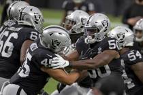 Las Vegas Raiders linebacker Nicholas Morrow (50) and Las Vegas Raiders fullback Alec Ingold (4 ...