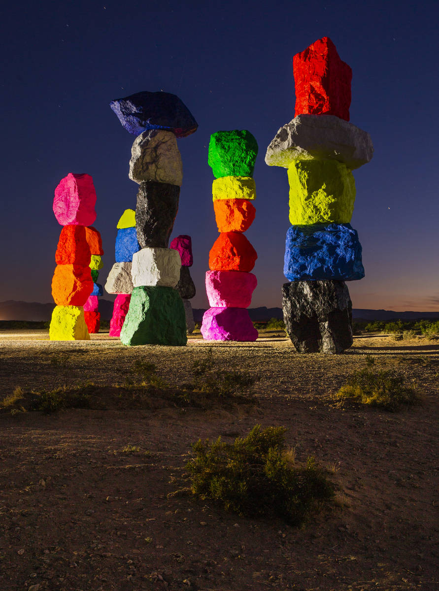 Lights illuminate the newly restored Seven Magic Mountains on June 19. Due to the installation' ...