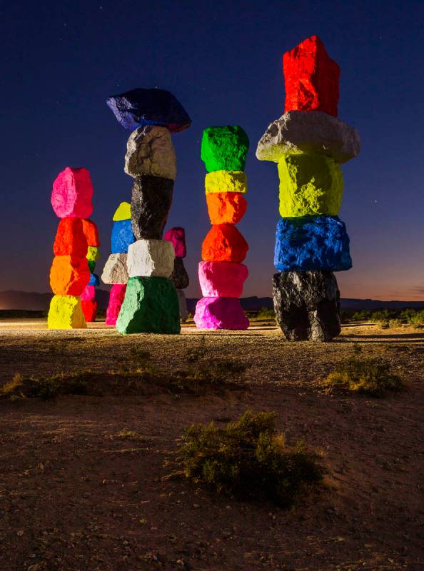 Lights illuminate the newly restored Seven Magic Mountains on June 19. Due to the installation' ...