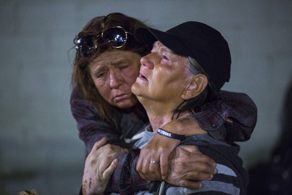 Alice Pate, left, comforts Kathleen Sutton as she talks about the struggles of living on the st ...