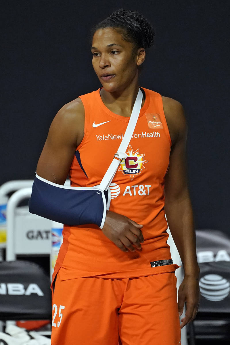Connecticut Sun forward Alyssa Thomas (25) watches from the bench after getting injured during ...