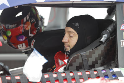 Race driver Kyle Busch preps to drive before the start of the NASCAR Cup Series auto race at In ...