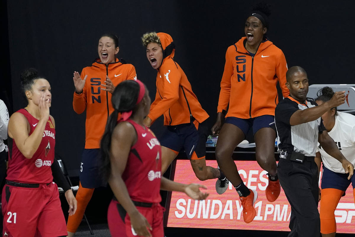 The Connecticut Sun bench celebrates during the second half of Game 3 of a WNBA basketball semi ...