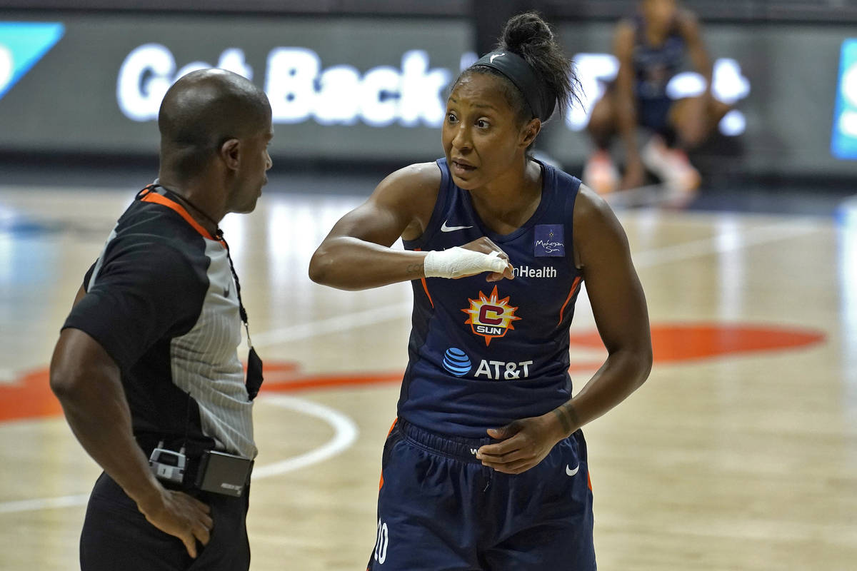 Connecticut Sun guard Briann January (20) argues with an official after she was called for a fo ...