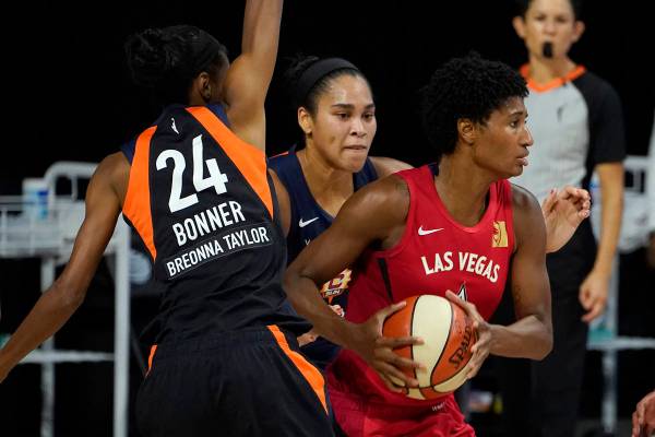 Las Vegas Aces forward Angel McCoughtry (35) looks to pass as she is guarded by Connecticut Sun ...