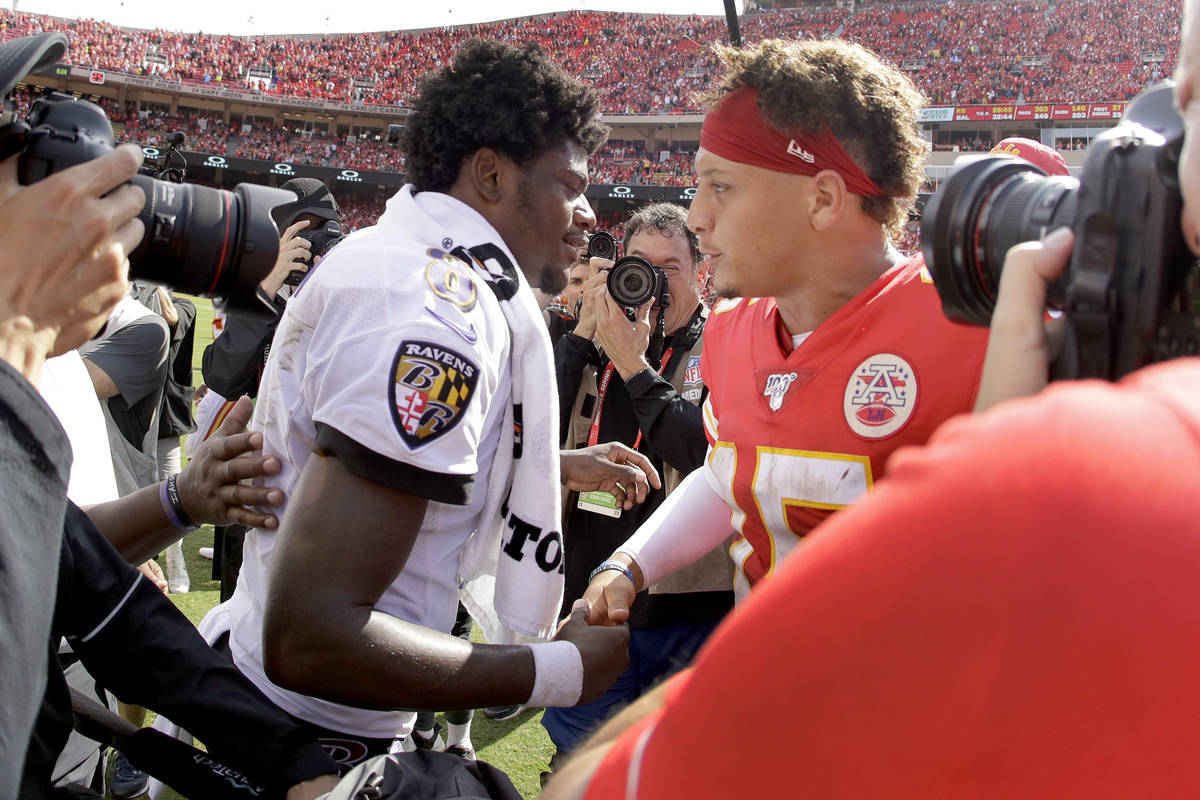 Kansas City Chiefs quarterback Patrick Mahomes, right, and Baltimore Ravens quarterback Lamar J ...