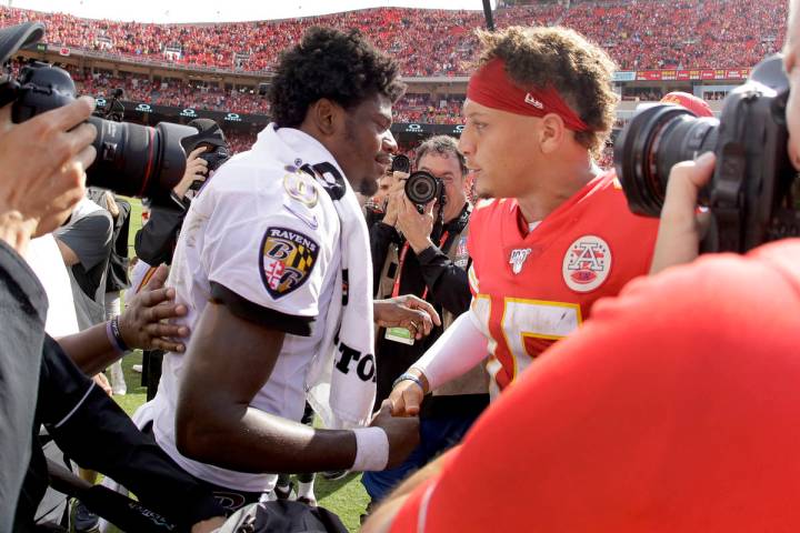 Kansas City Chiefs quarterback Patrick Mahomes, right, and Baltimore Ravens quarterback Lamar J ...