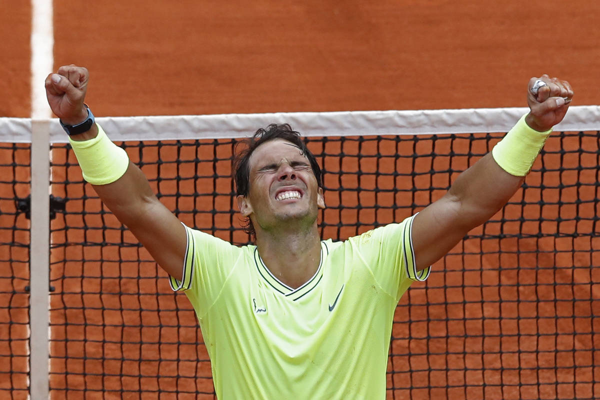 Spain's Rafael Nadal celebrates his record 12th French Open tennis tournament title after winni ...