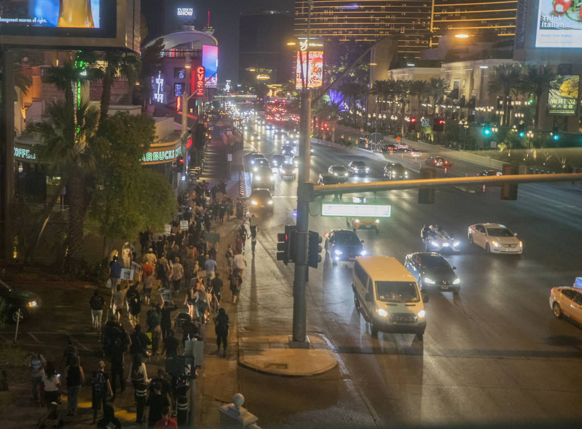 Protesters march to call for justice for Breonna Taylor on the Las Vegas Strip, Thursday, Sept. ...