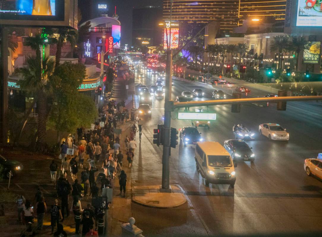 Protesters march to call for justice for Breonna Taylor on the Las Vegas Strip, Thursday, Sept. ...