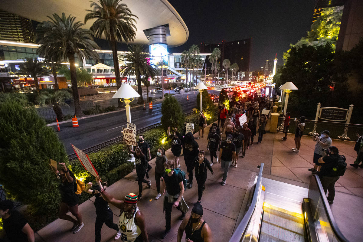Protesters march along the Las Vegas Strip to call for justice for Breonna Taylor on Thursday, ...