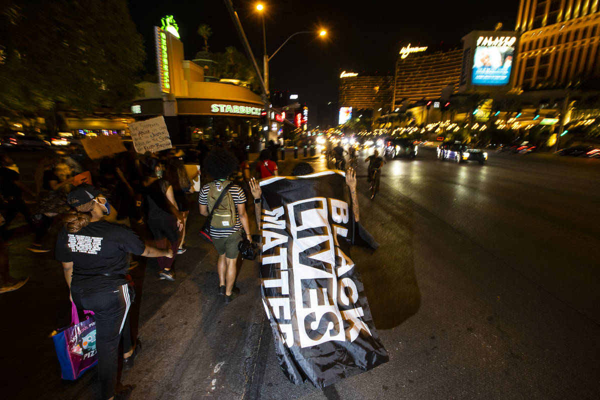 Protesters march along the Las Vegas Strip to call for justice for Breonna Taylor on Thursday, ...