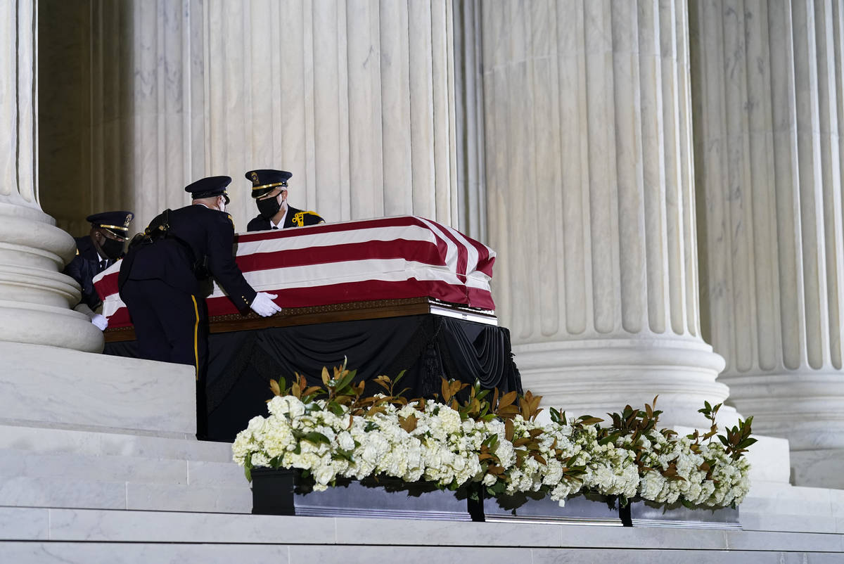 The flag-draped casket of Justice Ruth Bader Ginsburg arrives at the Supreme Court in Washingto ...