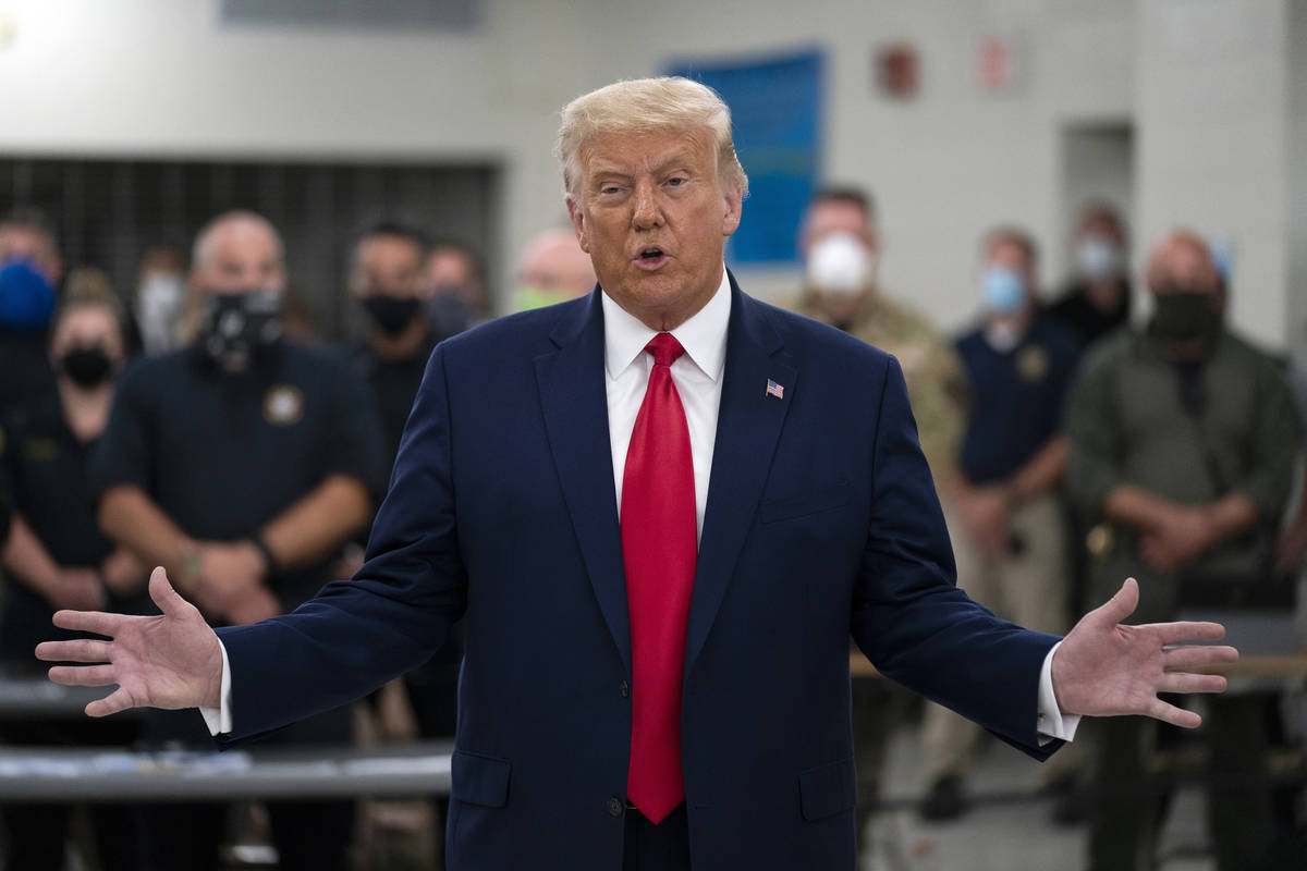 FILE - In this Tuesday, Sept. 1, 2020, file photo, President Donald Trump speaks as he tours an ...