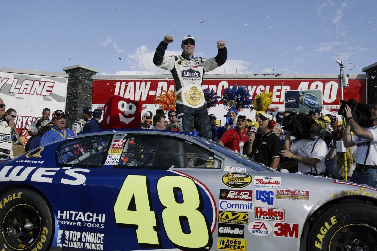 Jimmie Johnson celebrates his win in victory lane after the Nextel Cup Series at the Las Vegas ...