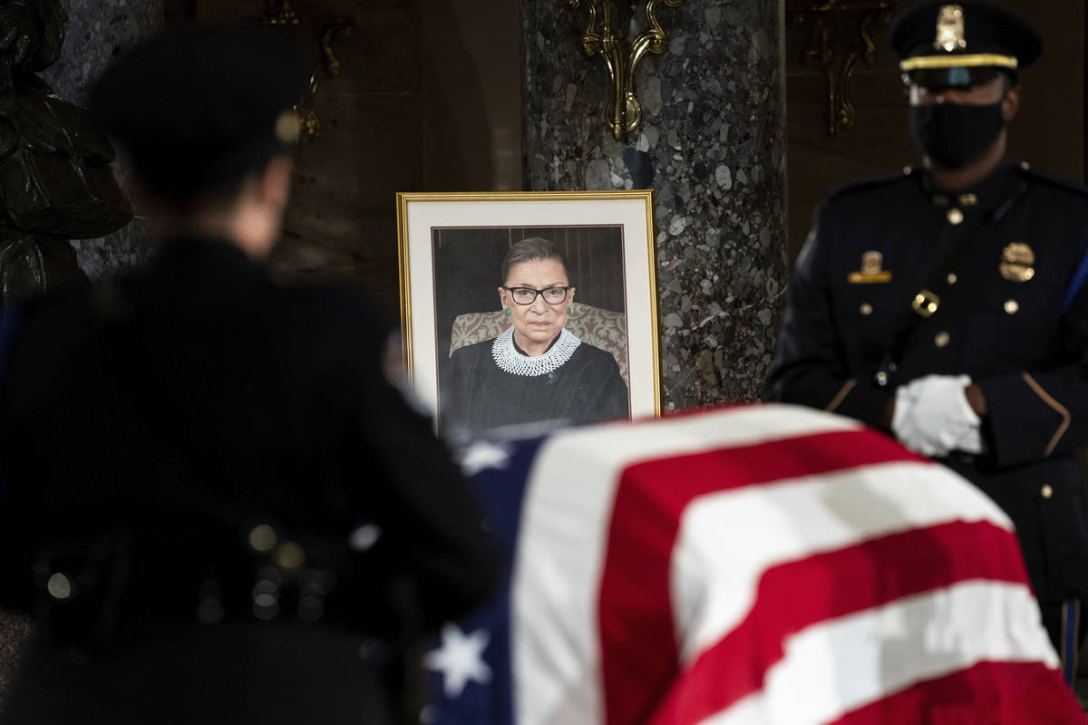 The flag-draped casket of Justice Ruth Bader Ginsburg lies in state in the U.S. Capitol on Frid ...