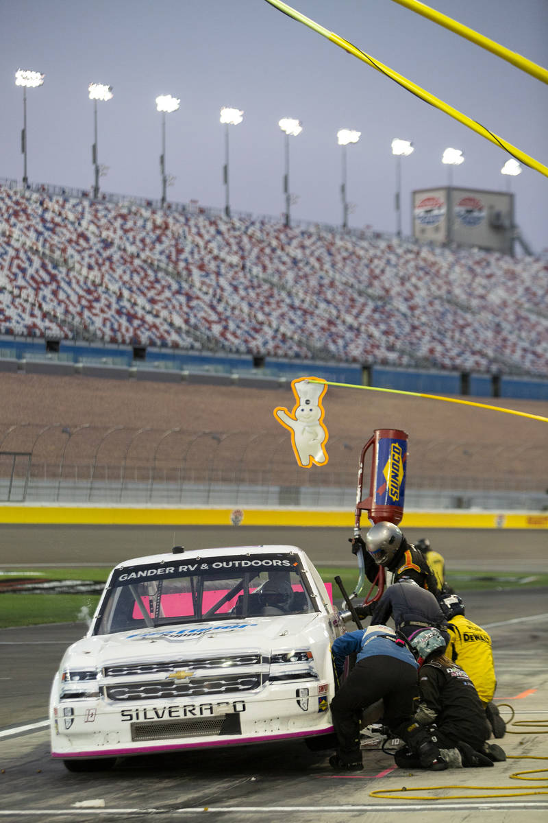 Jennifer Jo Cobb (10) pulls in for a pit stop in front of an empty stadium during the NASCAR We ...