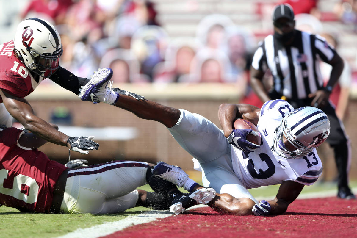 Kansas State wide receiver Chabastin Taylor (13) catches a touchdown pass in front of Oklahoma ...