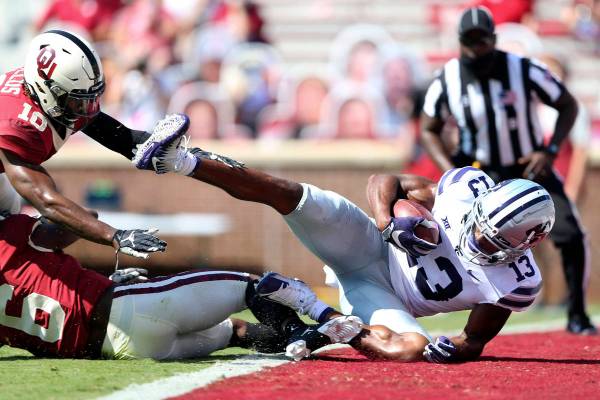 Kansas State wide receiver Chabastin Taylor (13) catches a touchdown pass in front of Oklahoma ...