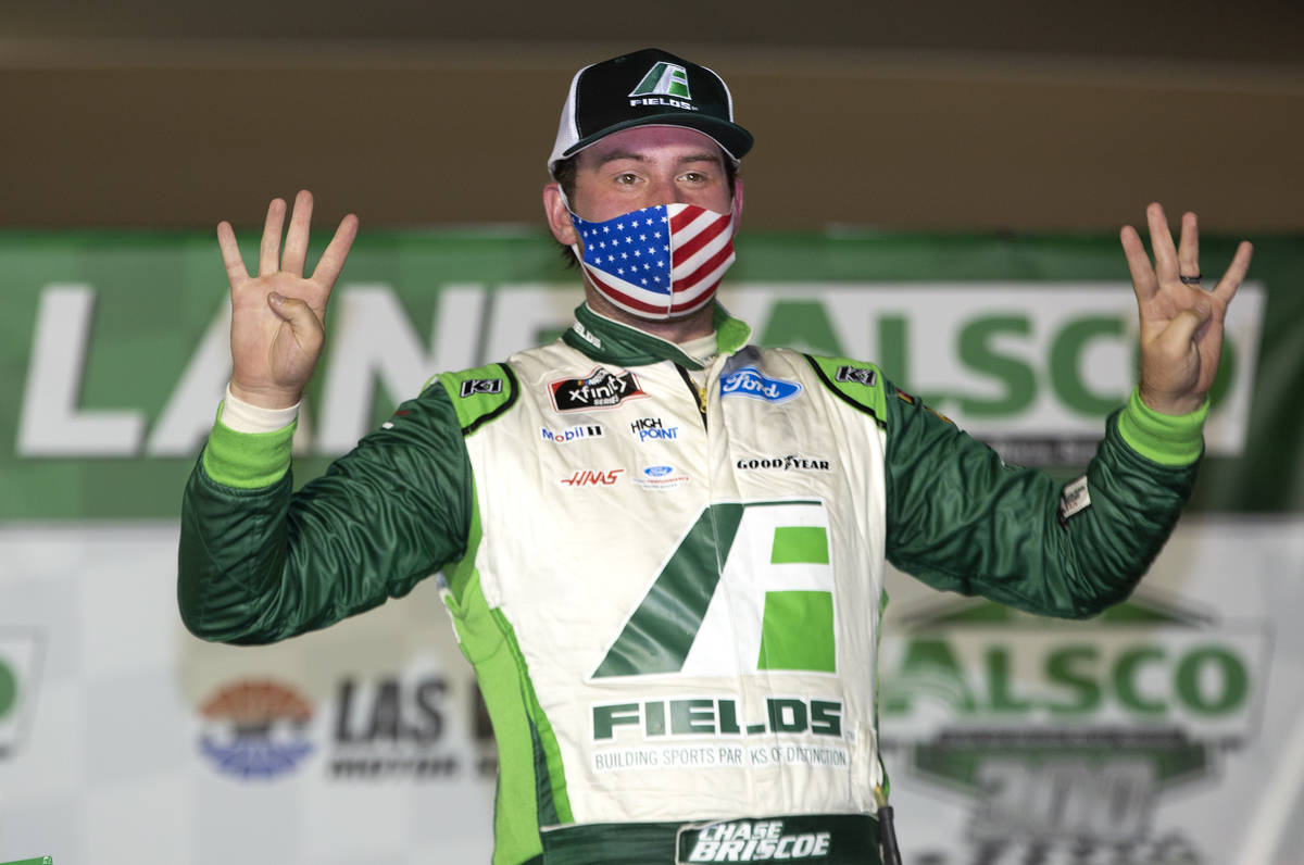 Alsco 300 race winner Chase Briscoe (98) poses in victory lane during the NASCAR Xfinity Series ...