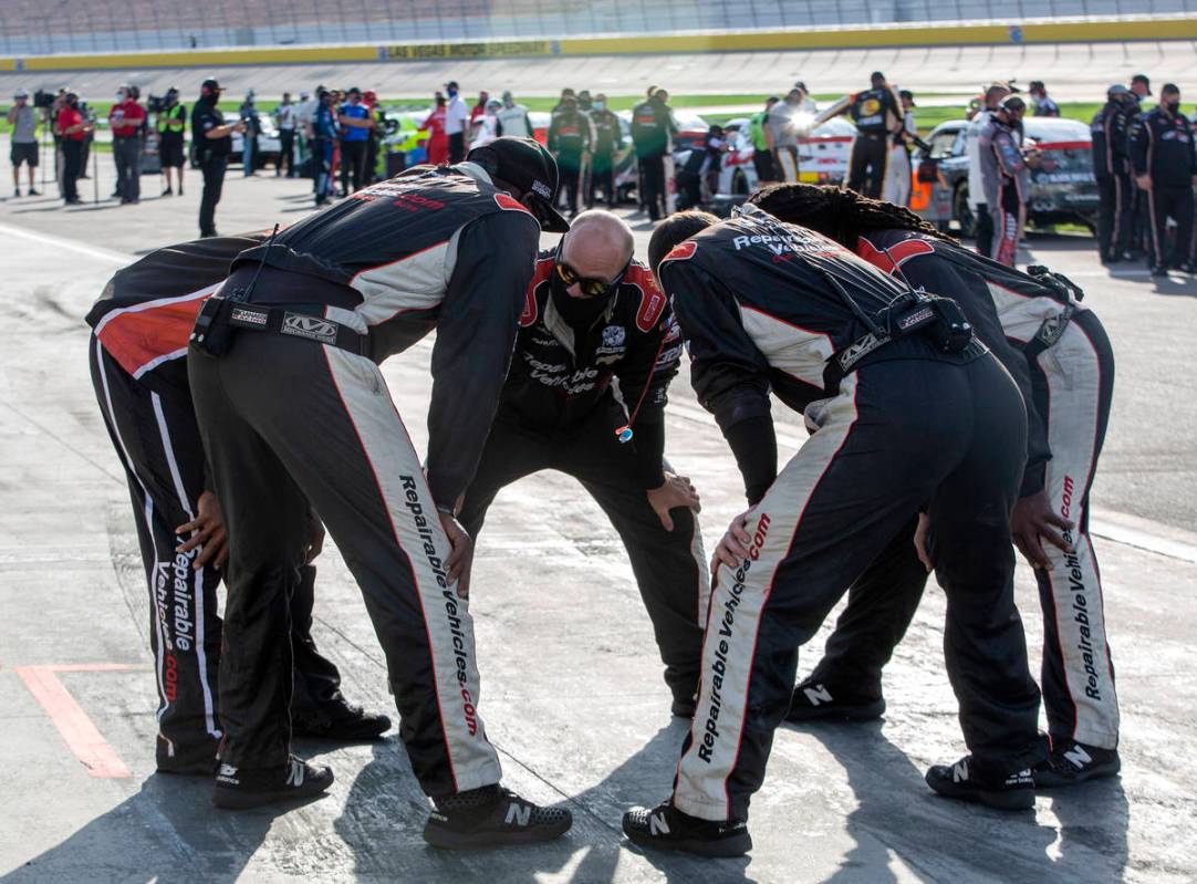 Jeremy Clements' pit crew (51) shares a moment before the Alsco 300 begins during the NASCAR Xf ...