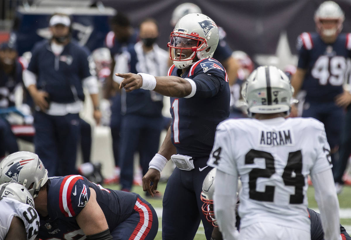 New England Patriots quarterback Cam Newton (1) calls an audible as Las Vegas Raiders strong sa ...