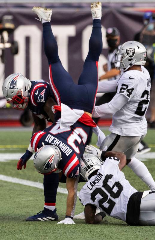 New England Patriots running back Rex Burkhead (34) leaps into the end zone for a touchdown pas ...