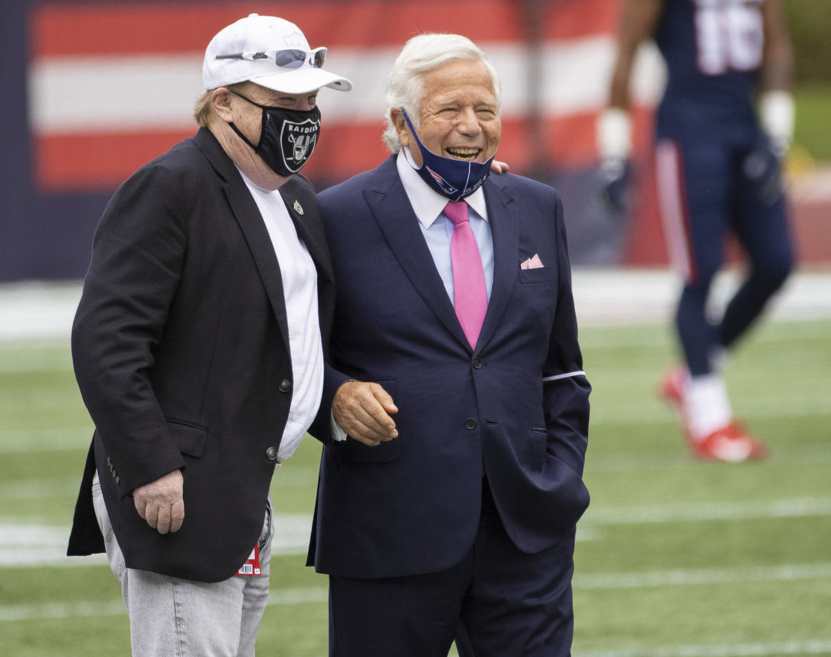 Las Vegas Raiders owner Mark Davis, left, talks with New England Patriots owner Robert Kraft be ...