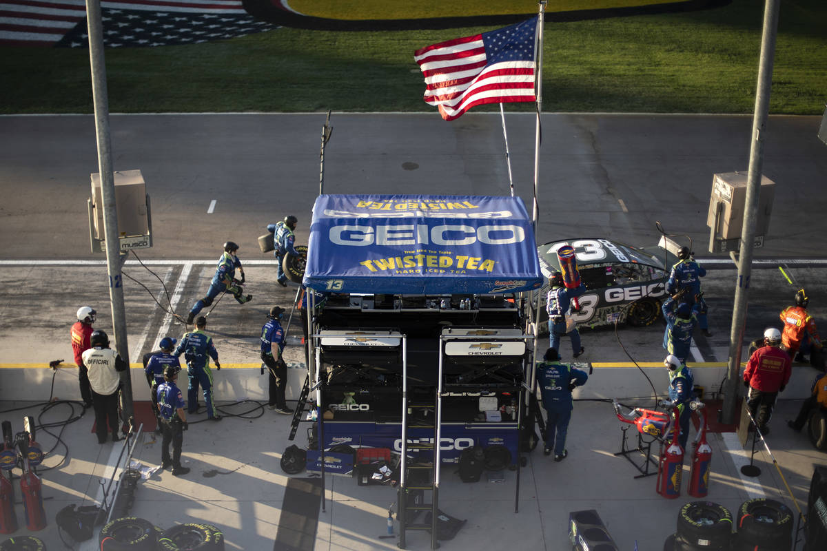 Ty Dillon (13) pulls in for pit stop while his crew rushes to get the job done during a NA ...