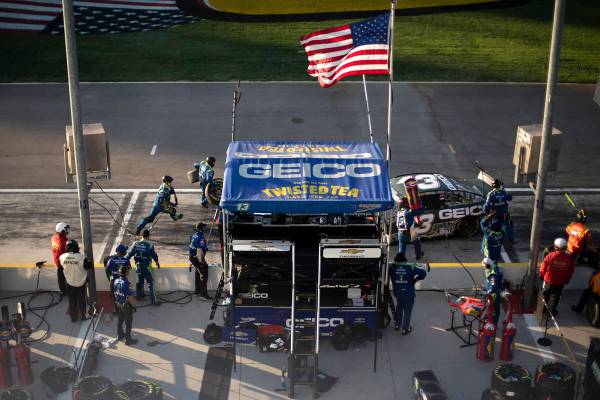 Ty Dillon (13) pulls in for pit stop while his crew rushes to get the job done during a NA ...