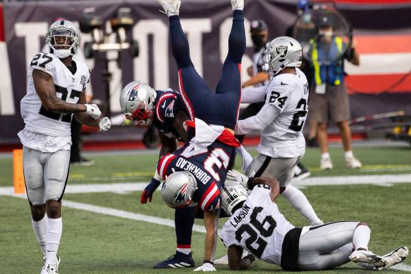 New England Patriots running back Rex Burkhead (34) leaps into the end zone for a touchdown pas ...