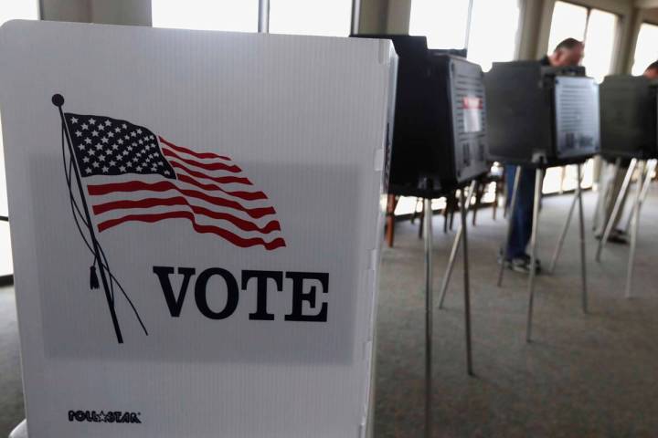 FILE - In this March 18, 2014 file photo, voters cast their ballots in Hinsdale, Ill. Illinois ...