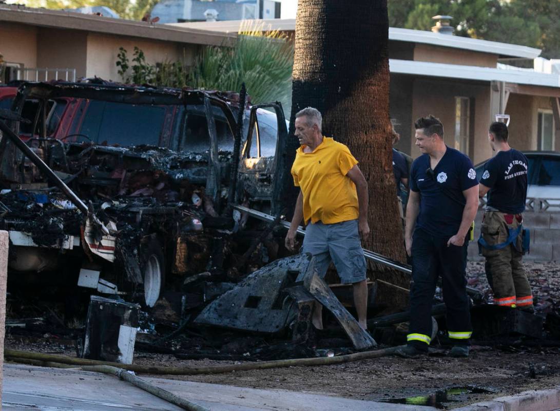A fire in a recreation vehicle damaged two homes and another vehicle near West Decatur Boulevar ...