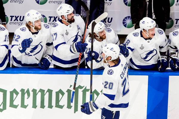 Tampa Bay Lightning's Blake Coleman (20) celebrates his goal against the Dallas Stars with team ...
